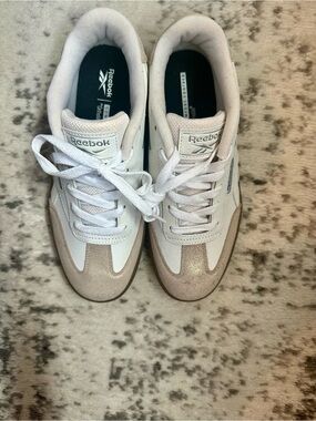 Reebok White Sneakers with Black Insole. Brand new. Never worn. No box.